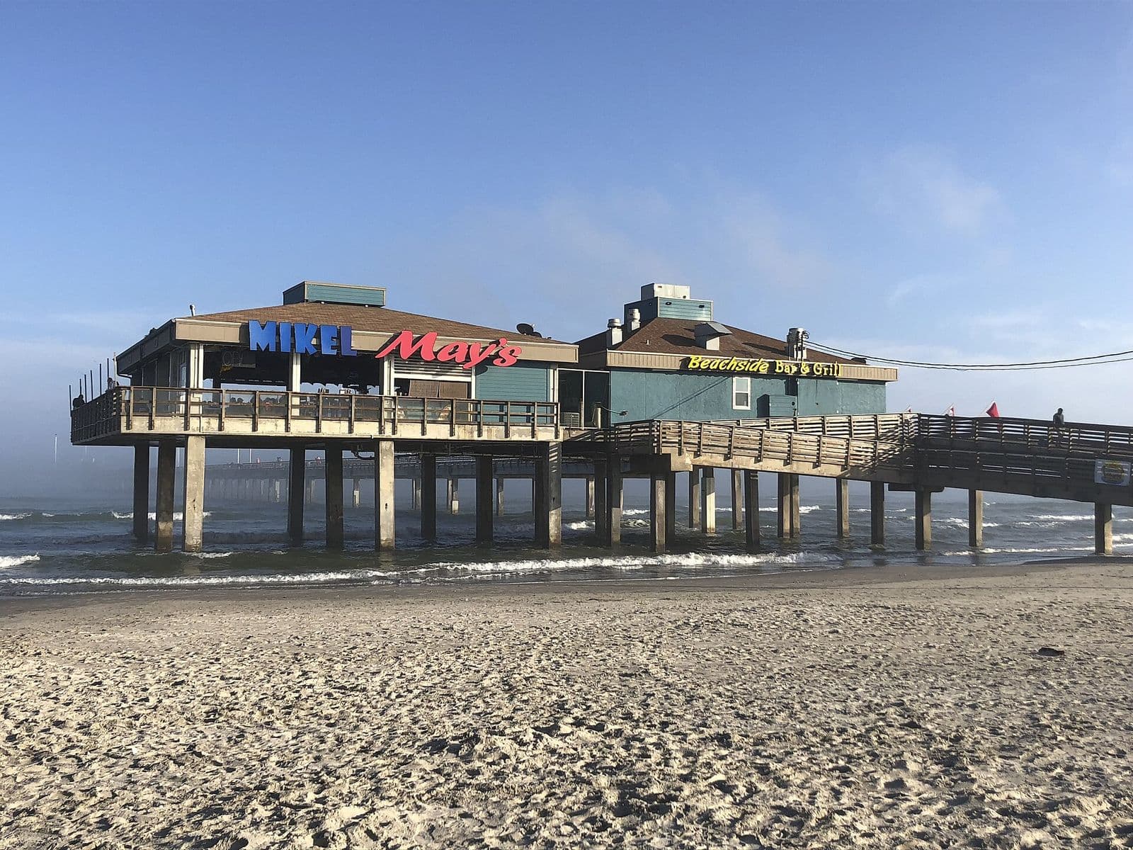Bob Hall Pier reaching out over the Gulf surf at Padre Balli Park