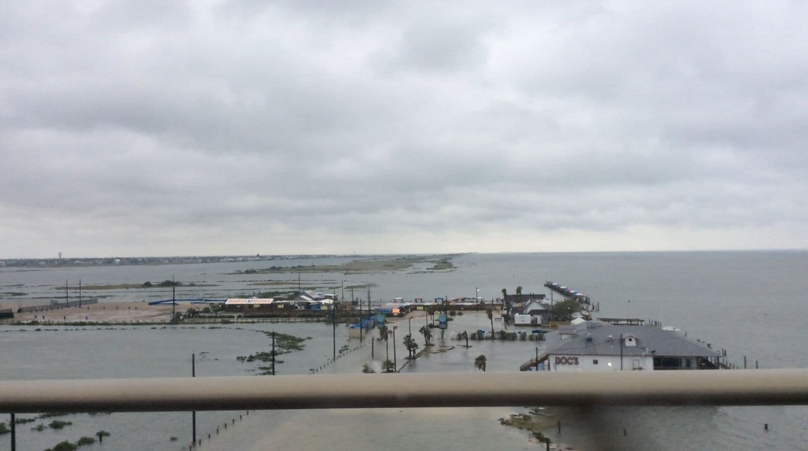 Overcast skies and storm-surge flooding along the Texas coast